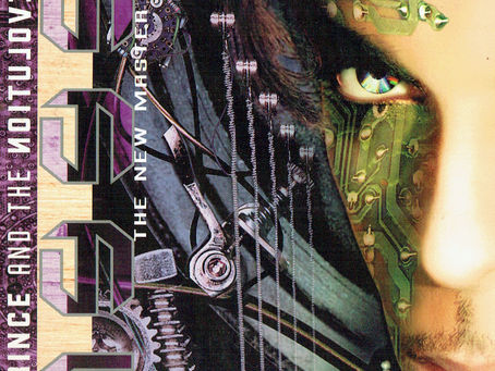 Close-up artwork featuring stylised facial adornments and metallic textures associated with the 1999 (The New Master) era.