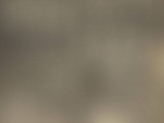 A vintage full‑page advert showing twelve David Bowie album covers arranged inside stylised television screens, accompanied by the headline “Compulsive Viewing and Listening” and a seated promotional portrait of Bowie.