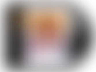 A vinyl album cover for the Labyrinth soundtrack showing a detailed illustrated collage from the film. David Bowie appears at the top in costume as the Goblin King, surrounded by characters and creatures from the movie. Below him is a young woman in a flowing dress. The title “Labyrinth” is printed in stylized gold lettering. A white vinyl record is partially visible beside the sleeve.