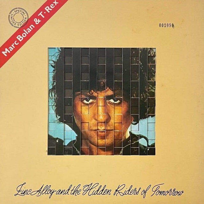 A layered cream‑toned gatefold design forming a cage motif around Marc Bolan’s portrait.