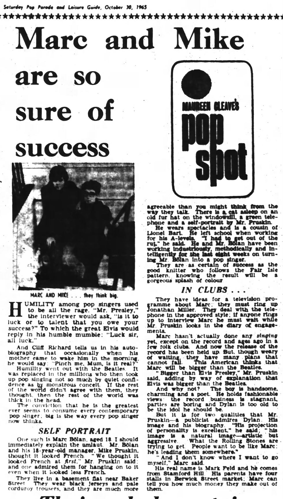 A scanned 1965 newspaper page featuring a column titled “Pop Spot” by Maureen Cleave. At the centre is a black‑and‑white photograph of Marc Bolan and Mike Prushkin seated on stairs. Text columns surround the image, with a bold headline and period‑accurate layout.