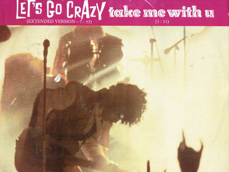 UK 12" single cover for “Let’s Go Crazy / Take Me With U,” featuring Prince and the Revolution in a dramatic live performance shot with purple banner text.