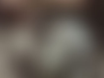 David Essex stands beside a futuristic silver motorcycle, wearing a black racing suit with red, white, and blue stripes. The text “David Essex – Silver Dream Machine (Part One)” appears above in bold stylised lettering.