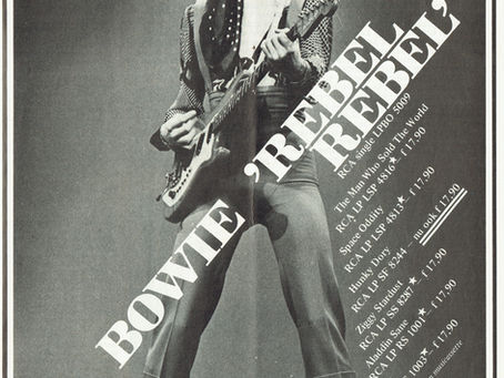 A one‑page magazine advert featuring David Bowie in an eyepatch and glam‑rock outfit, holding a guitar. The advert promotes “Rebel Rebel” and lists several RCA albums with Dutch pricing.