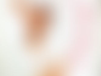 A portrait of Sheila E. performing onstage, playing timbales with dynamic energy, dressed in her signature glamorous performance attire.