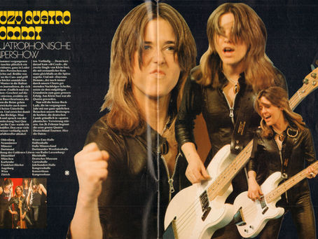 A two‑page POP Magazine spread featuring Suzi Quatro performing in black leather, playing a white bass guitar, with German text announcing her 1974 “Quatrophonic Supershow” tour.