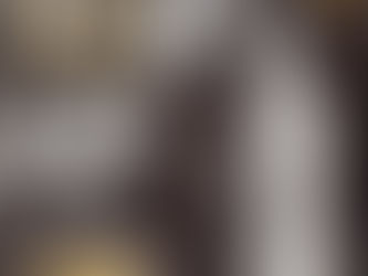 A monochrome cover showing David Essex in a coat against blurred city lights, with bold gold lettering reading “DAVID ESSEX – CITY LIGHTS.”