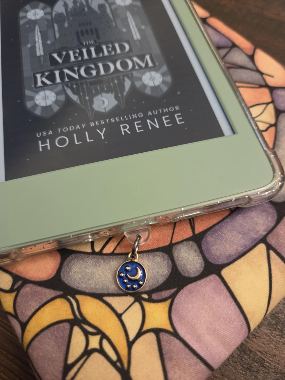 E-reader with blue moon and stars keychain charm