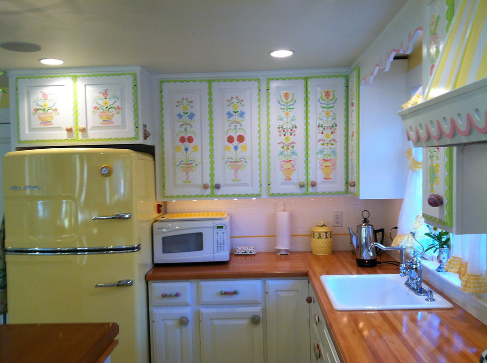 Fun handprinted cabinets with the happy yellow fridge