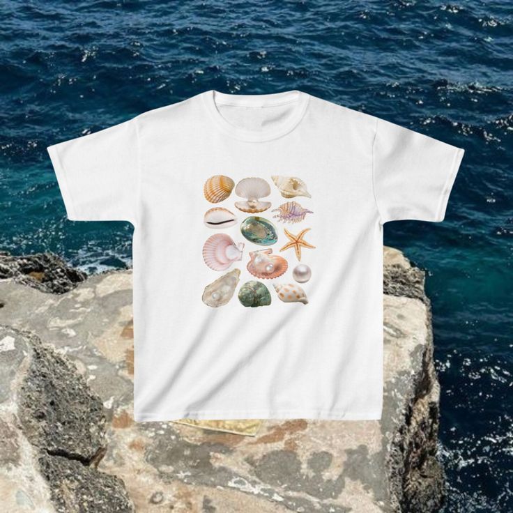 Seashells and starfish on white tee