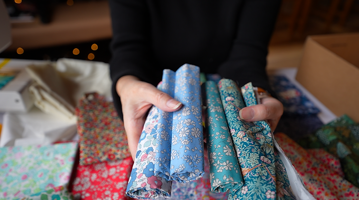 Holding LIberty fabric.png