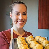 Owner of Cookie Cabin holding fresh dough
