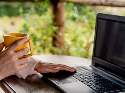 A neurodivergent employee working remotely at home, using accommodations to support focus and reduce workplace stress.
