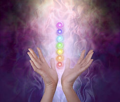 Working with the Seven Major Chakra Energy Vortexes - female healer's hands either side
