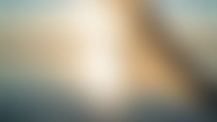 Soft flowing fabric in a sunlit landscape symbolizing healing, integration, and gentle transformation after trauma.