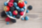 Fresh-berries-in-a-basket-on-rustic-wooden-background.-521432062_6000x4000.jpeg