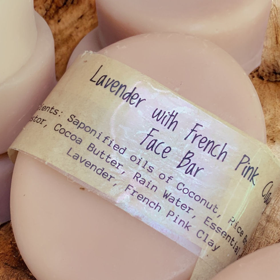 a close up of a petite oval shaped pale pink soap with kraft brown label Lavender & Pink Clay Face Bar