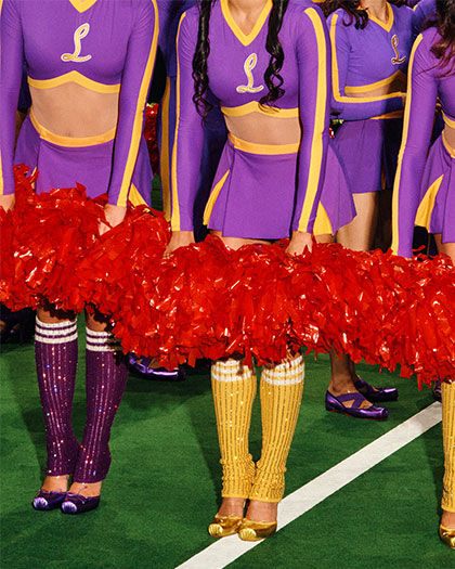 Cheerleaders in purple and gold wearing Louboutin shows, at Christian Louboutin Loubi Show VI