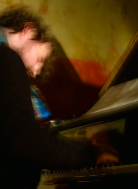 Wilfie playing piano at The Django in NYC