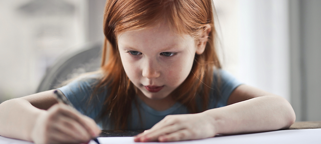 girl writing in feelings journal
