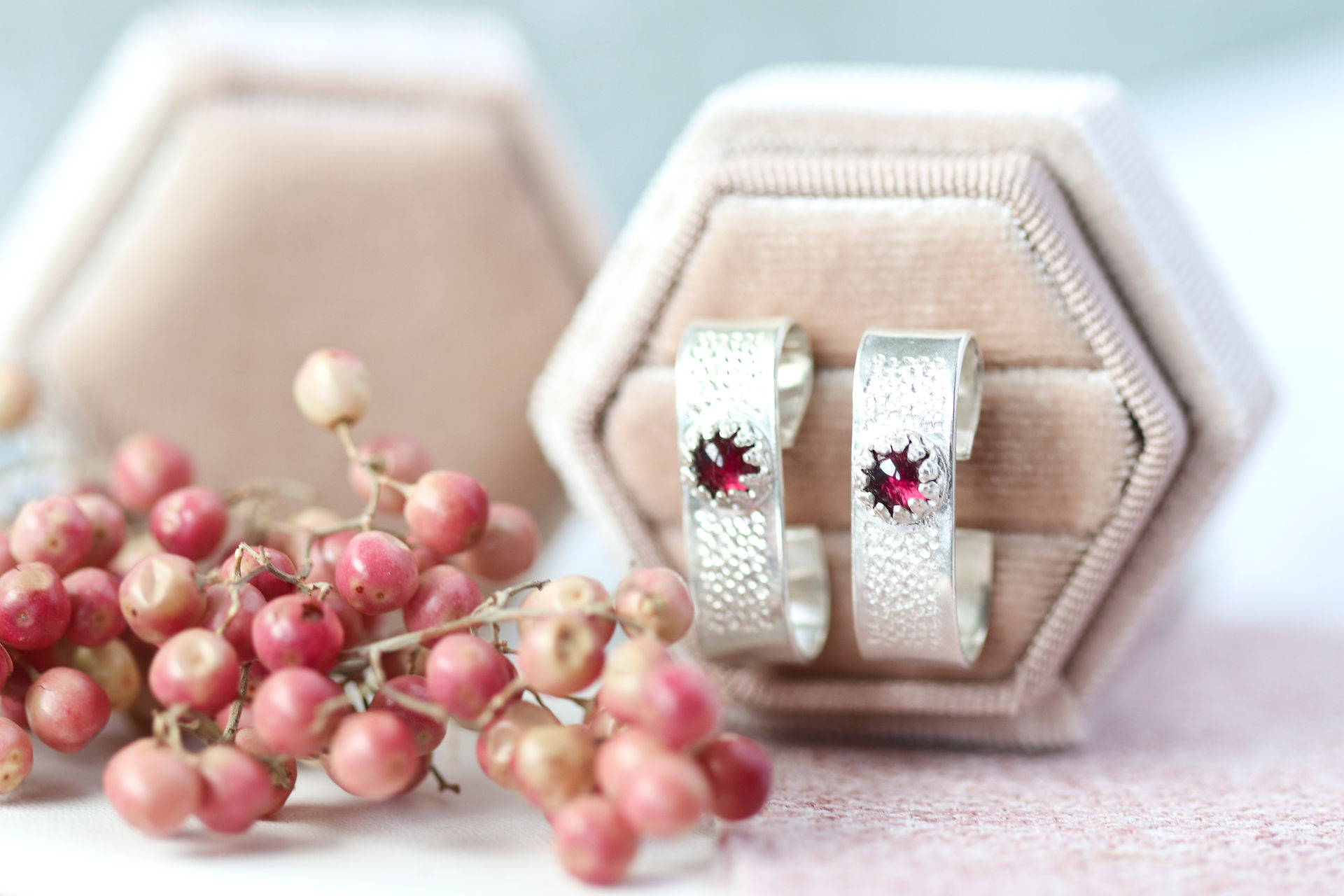 Scrolled silver earrings with garnets