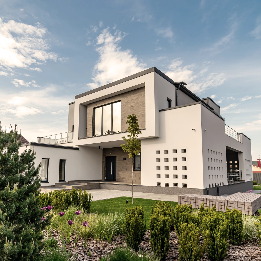 cozy-modern-house-with-garage-cobblestone-driveway-modern-architecture.webp