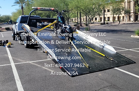 Motorcycle towing with a rollback flatbed tow truck; transporting and delivering a motorcycle