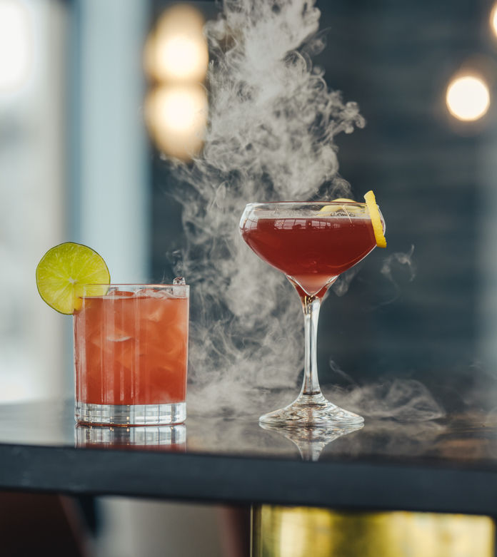 A selection of expertly crafted cocktails, each meticulously prepared with premium ingredients and artistic garnishes in Houghton, Michigan, Keweenaw Peninsula. 