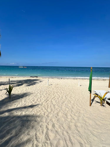 Enjoying a relaxing day at West Bay Beach, Roatan, with resort amenities.