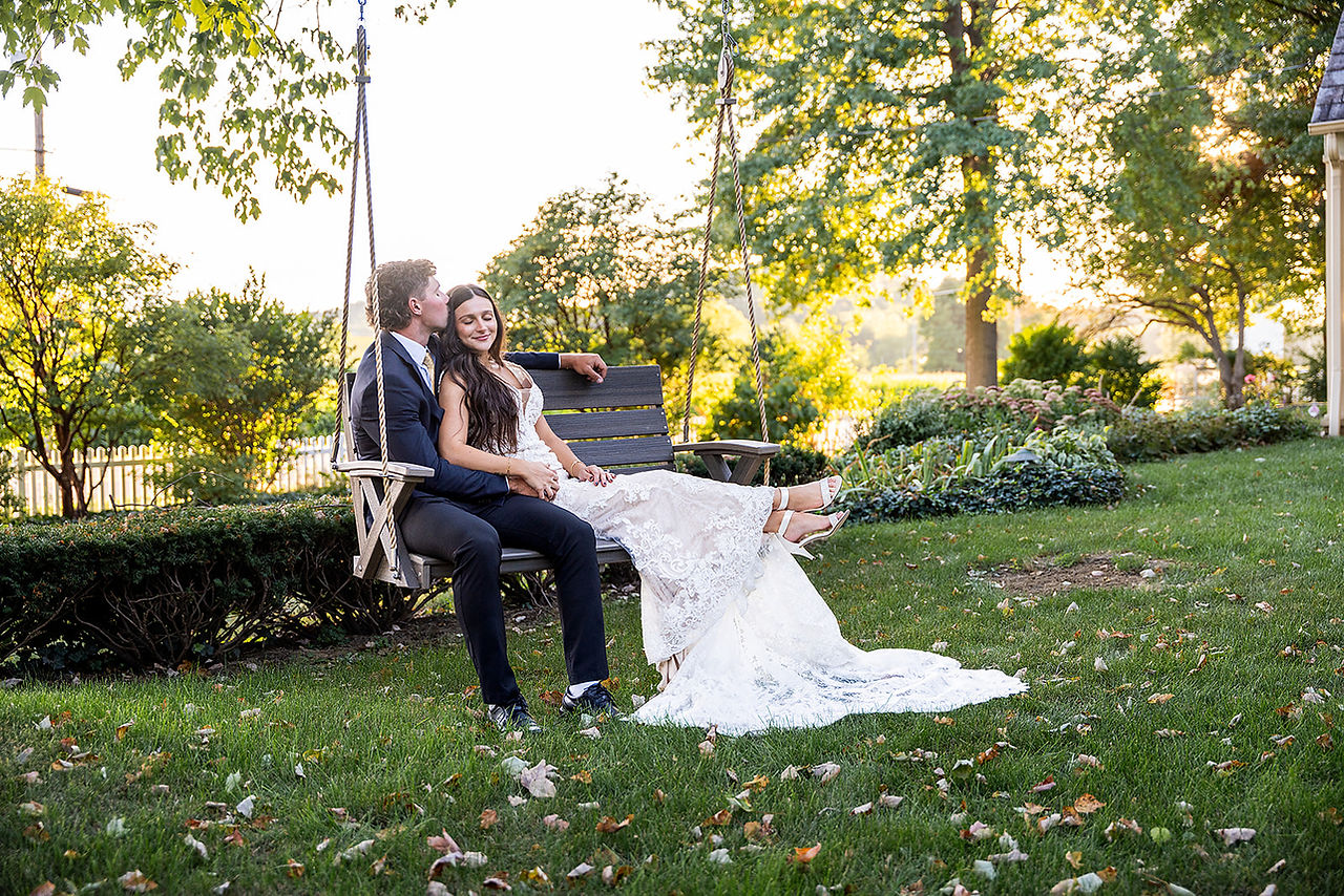 Swings at luxury barn and garden wedding venue near Canton, Ohio allow guests to relax and enjoy