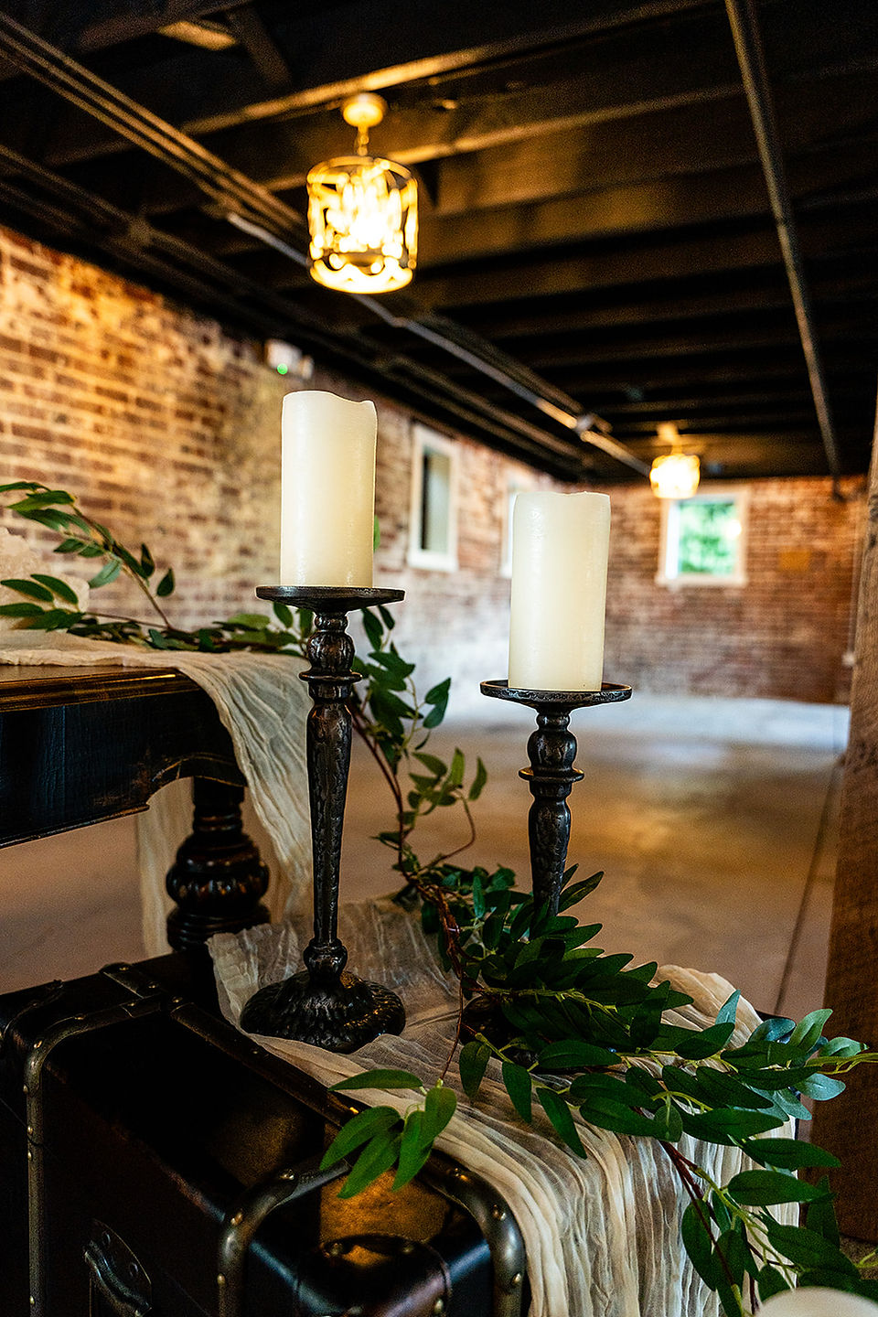 Romantic, moody setting with exposed brick and black ceilings at wedding venue near Canton, Ohio