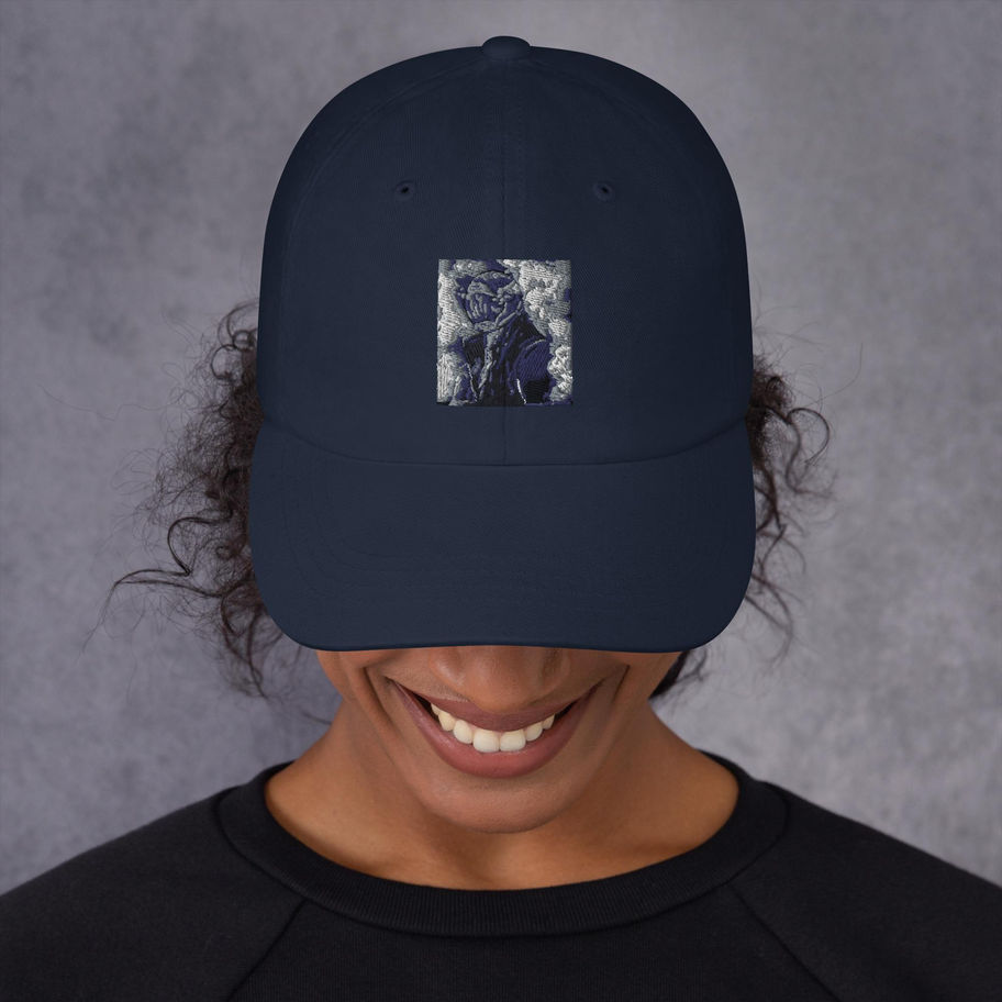 Woman wearing a navy blue baseball cap with a graphic