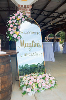 sign welcoming to Quinceañera celebration at La Hacienda Venue