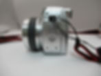 Olympus SP-510UZ left side view showing DC input cover