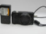 Fujifilm FinePix F900EXR compact digital camera with charger and USB cable