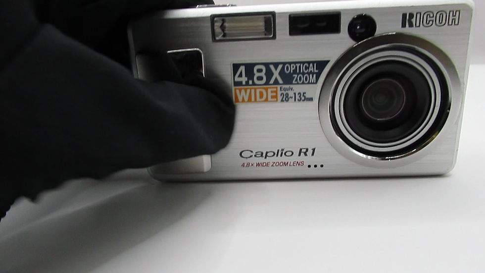 Thumbnail: Video showing the unique lens opening and startup mechanism of the Ricoh Caplio R1 compact digital camera