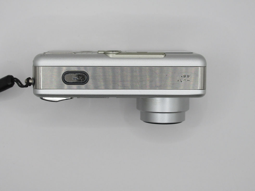 Thumbnail: Top view of Ricoh Caplio R1 silver compact digital camera body