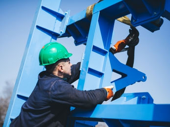 Manual worker working at shipyard construction site