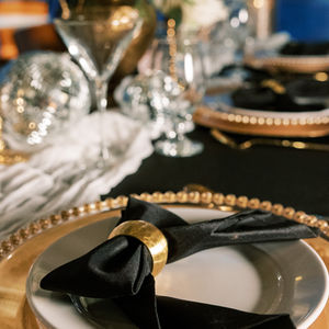 gold chargers, beaded chargers, black napkins, 