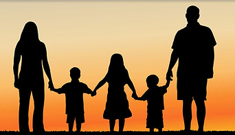 Family Standing in sunset