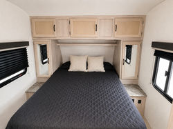Private queen bedroom with wardrobe storage in the Coachmen Spirit Ultra Lite.