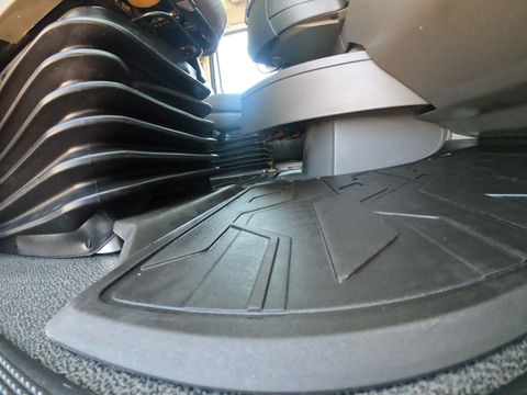 Technician performing professional interior and exterior detailing on a semi-truck fleet, cleaning and polishing commercial vehicle surfaces for improved appearance and maintenance.