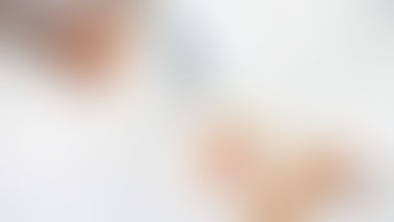 Measuring a white wall corner with a yellow measuring tape