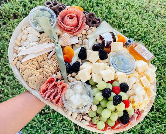 Large grazing box built onto a disposable palm leaf platter