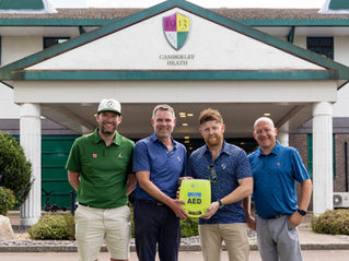 Charlie Edinburgh (JE3 Foundation), Terry Long (Camberley Heath Golf Club), Bobby Prendeville (Link Consultants) and Darren Sheen (Echo Sixty One Events Ltd) outside Camberley Heath Golf Club holding one of the three AEDs