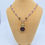 Thumbnail: Vintage intaglio on a necklace of gold fill, Amethyst