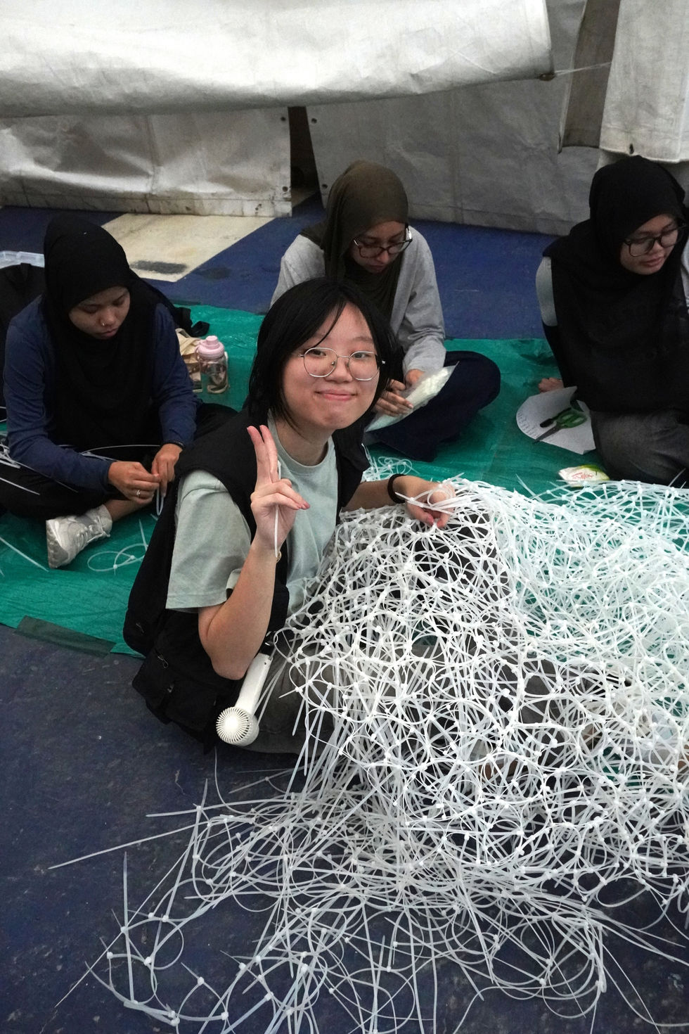 Shayna doing cable ties (brightened)