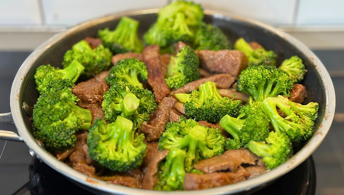 Tender beef, bright broccoli and shallots come together in a glossy soy and Worcestershire sauce with garlic, ginger and sesame. Briefly boiling and chilling the broccoli keeps it vivid and crisp, while starch helps the beef stay juicy and the sauce cling.