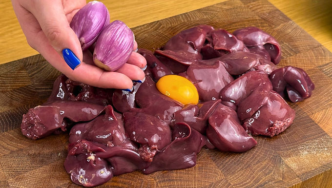 Chicken livers are seasoned with cumin and garlic, dipped in egg and flour, then pan-fried before simmering gently with shallots and cream. The coating keeps each piece tender and gives the sauce body, creating a comforting dinner that pairs well with potatoes.