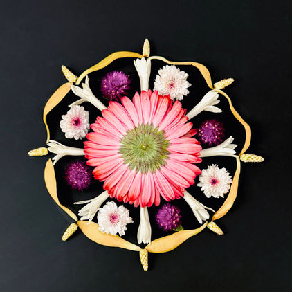 Flower mandala with sampige flowers.